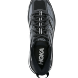 Black sneakers, vertical view