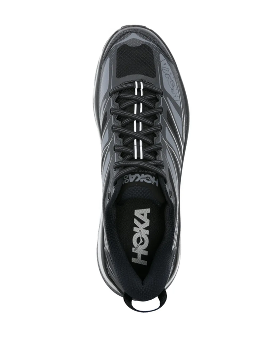 Black sneakers, vertical view
