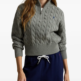 Grey knitwear worn by a person, showing the knitwear fit
