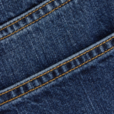 Close up of the blue jeans, showing texture of the cotton fabric