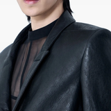 close up of black jackets-coats , showing texture of the lambskin fabric