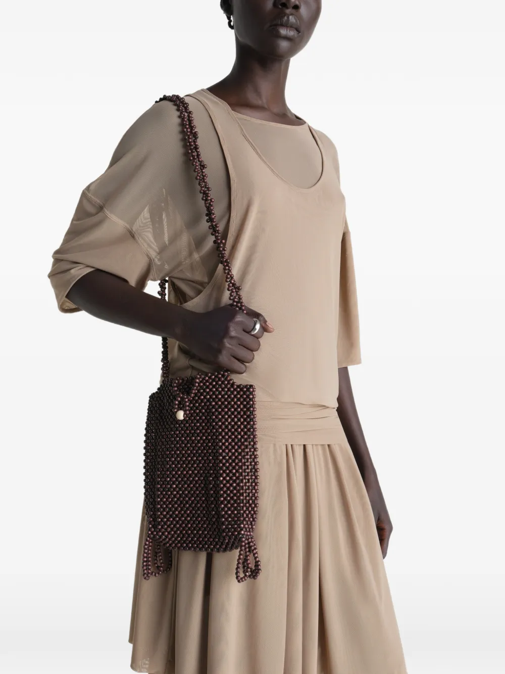 Brown bag worn by a person, showing the bag's fit