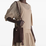 Brown bag worn by a person, showing the bag's fit
