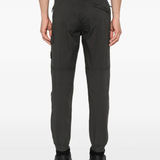 Grey pants worn by a person, showing the pants fit