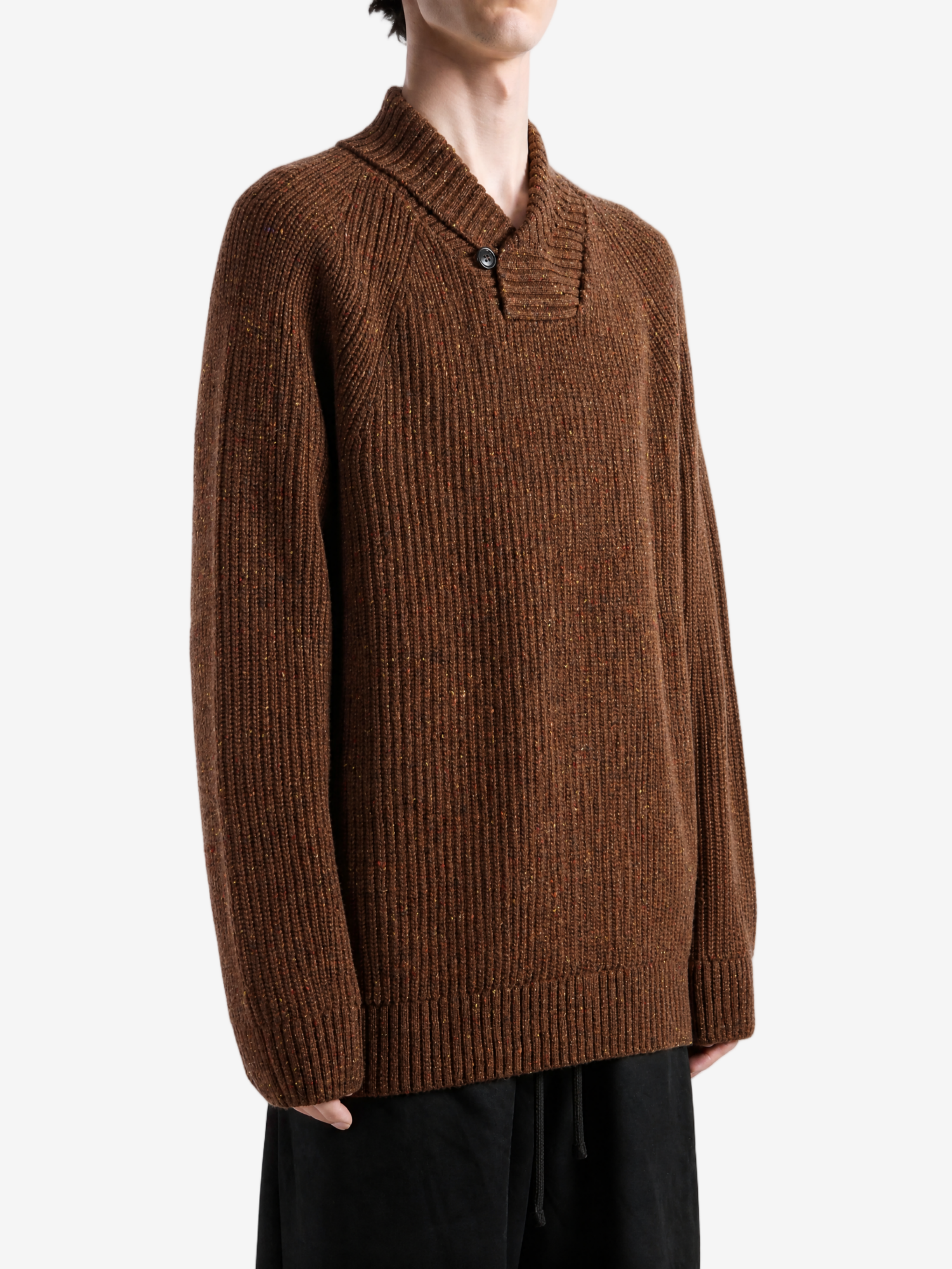 Brown hoodie worn by a person, showing the hoodie fit