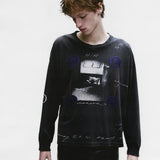 Black t-shirt worn by a person, showing the shirt's fit