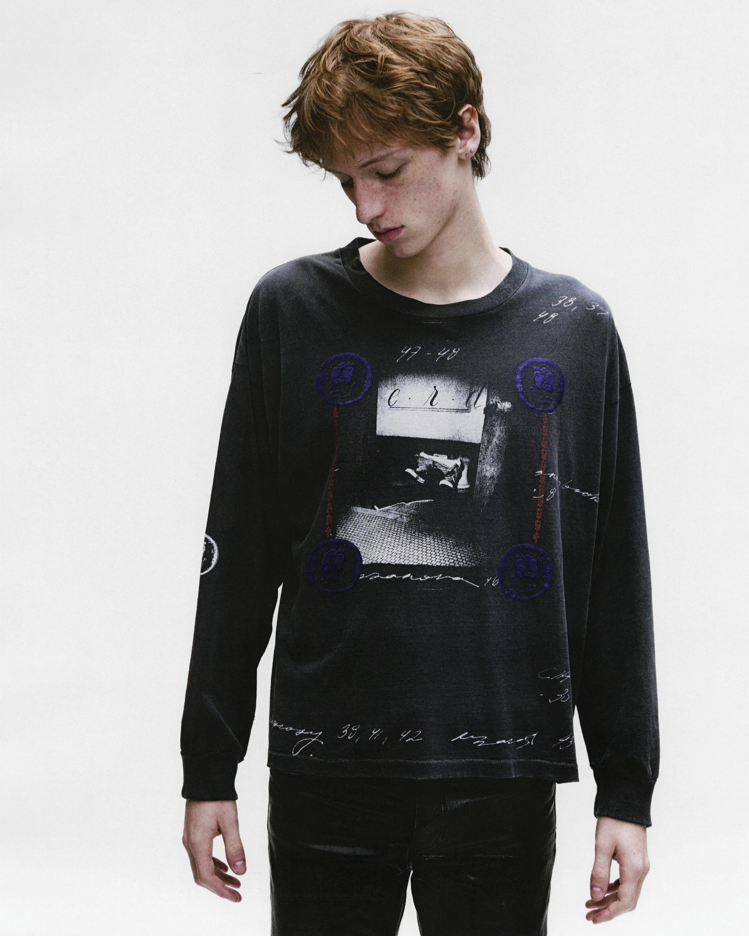 Black t-shirt worn by a person, showing the shirt's fit