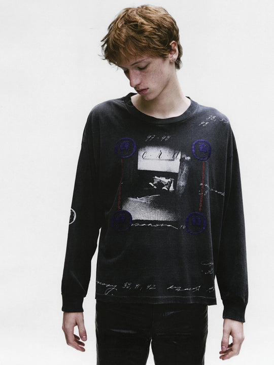 Black t-shirt worn by a person, showing the shirt's fit