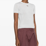 white knitwear worn by a person, showing the knitwear fit