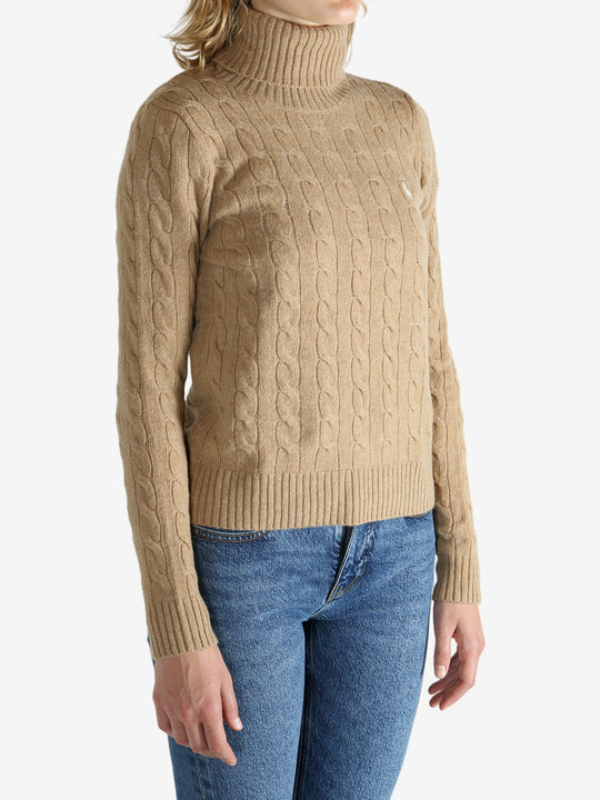 Tan pullover worn by a person, showing the pullover's fit