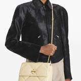 Yellow bags worn by a person, showing the bags fit