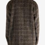 Brown knitwear worn by a person, showing the knitwear's fit