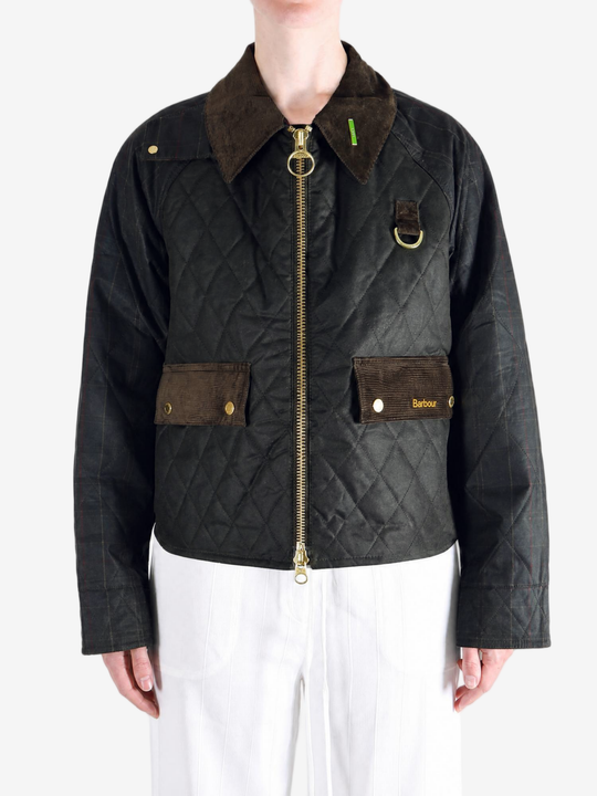 Black jacket worn by a person, showing the jacket fit