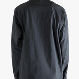 Gray jacket worn by a person, showing the jacket fit