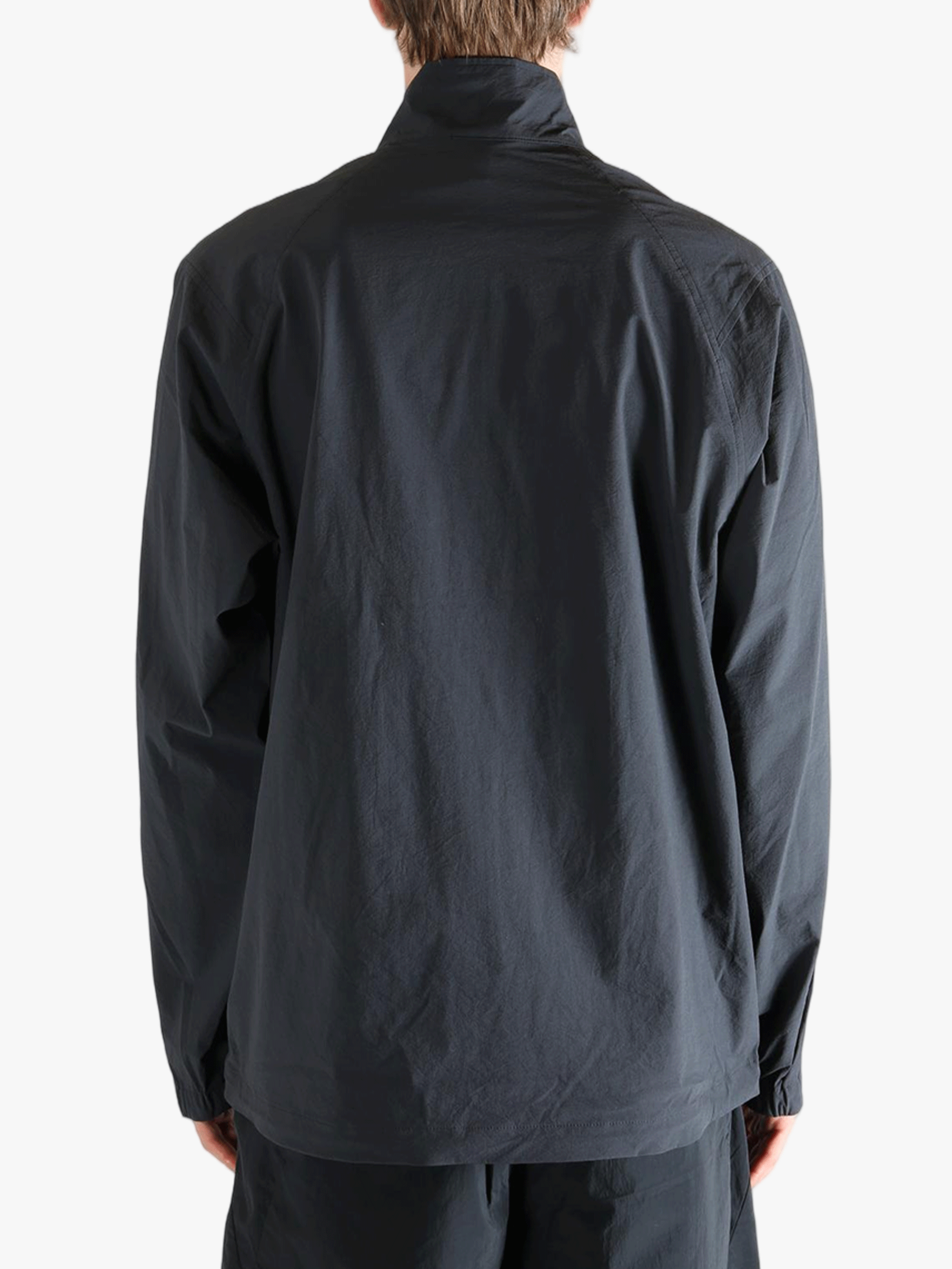 Gray jacket worn by a person, showing the jacket fit