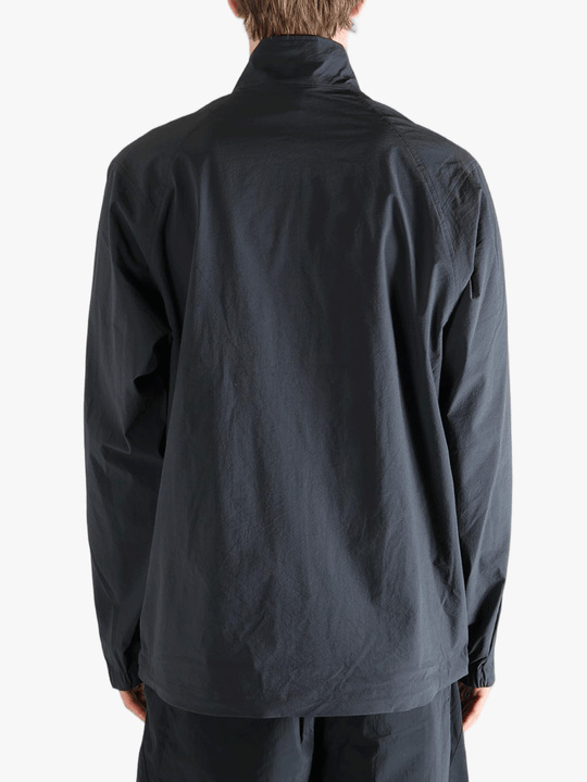 Gray jacket worn by a person, showing the jacket fit