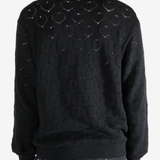 Black jackets worn by a person, showing the jackets fit