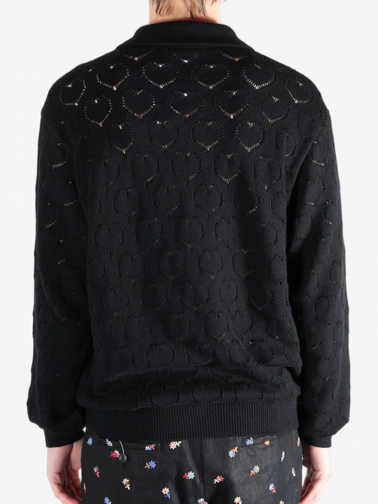 Black jackets worn by a person, showing the jackets fit