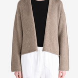 Tan jacket worn by a person, showing the jacket fit