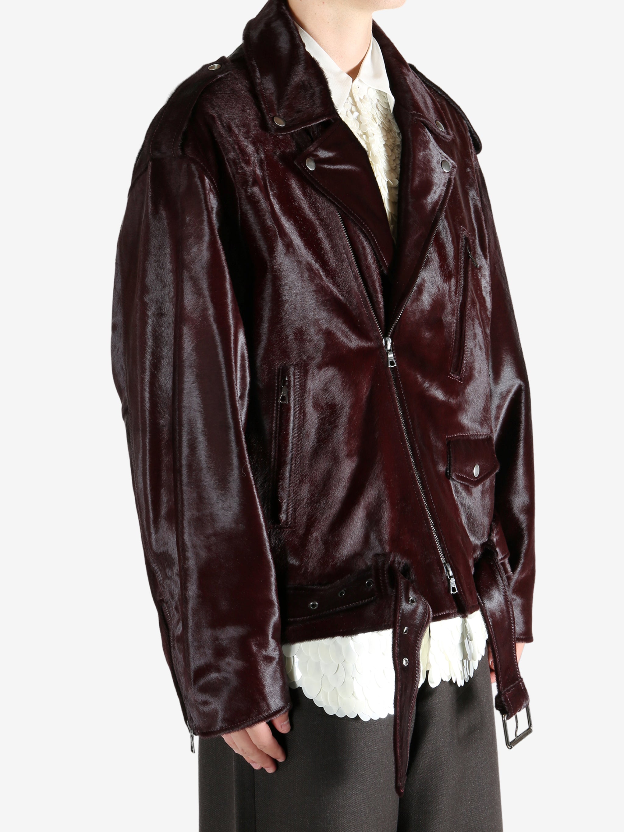 Brown jacket worn by a person, showing the jacket fit