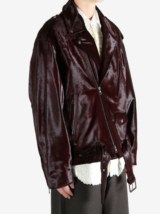 Brown jacket worn by a person, showing the jacket fit