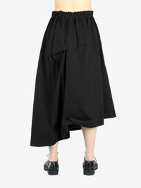 Black skirt worn by a person, showing the skirt's fit