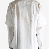 White T-shirt worn by a person, showing the T-shirt's fit