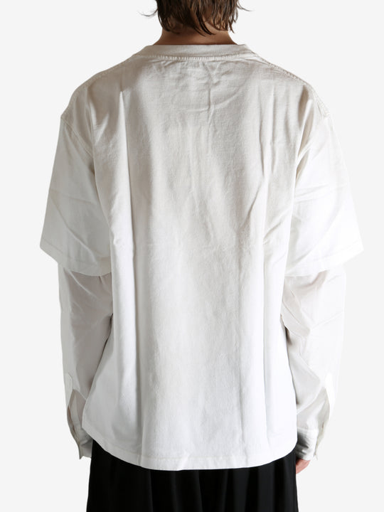 White T-shirt worn by a person, showing the T-shirt's fit