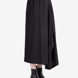 Black skirt worn by a person, showing the skirt fit