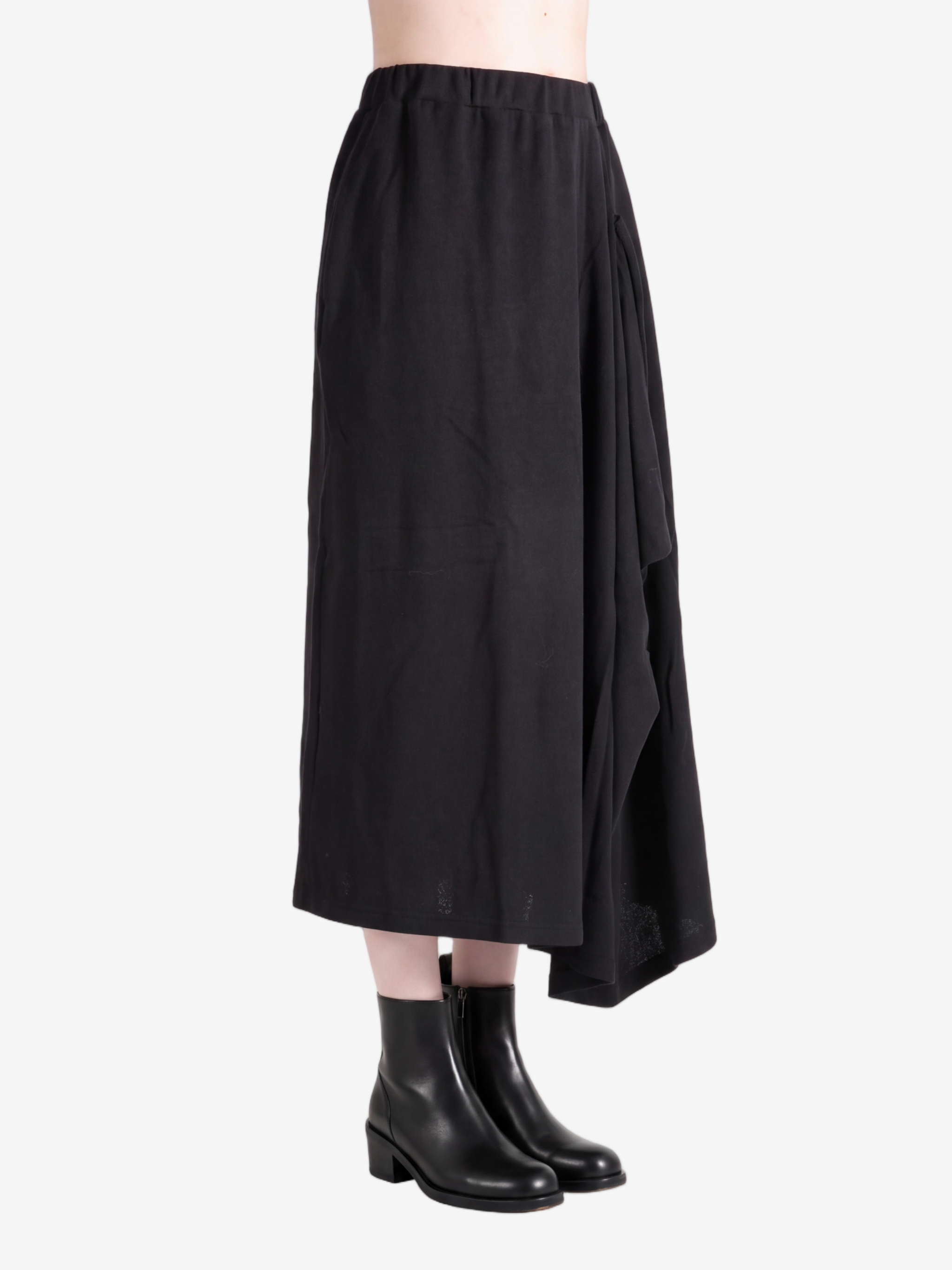 Black skirt worn by a person, showing the skirt fit
