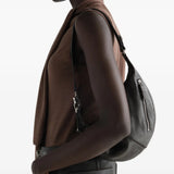 Brown bag worn by a person, showing the bag fit