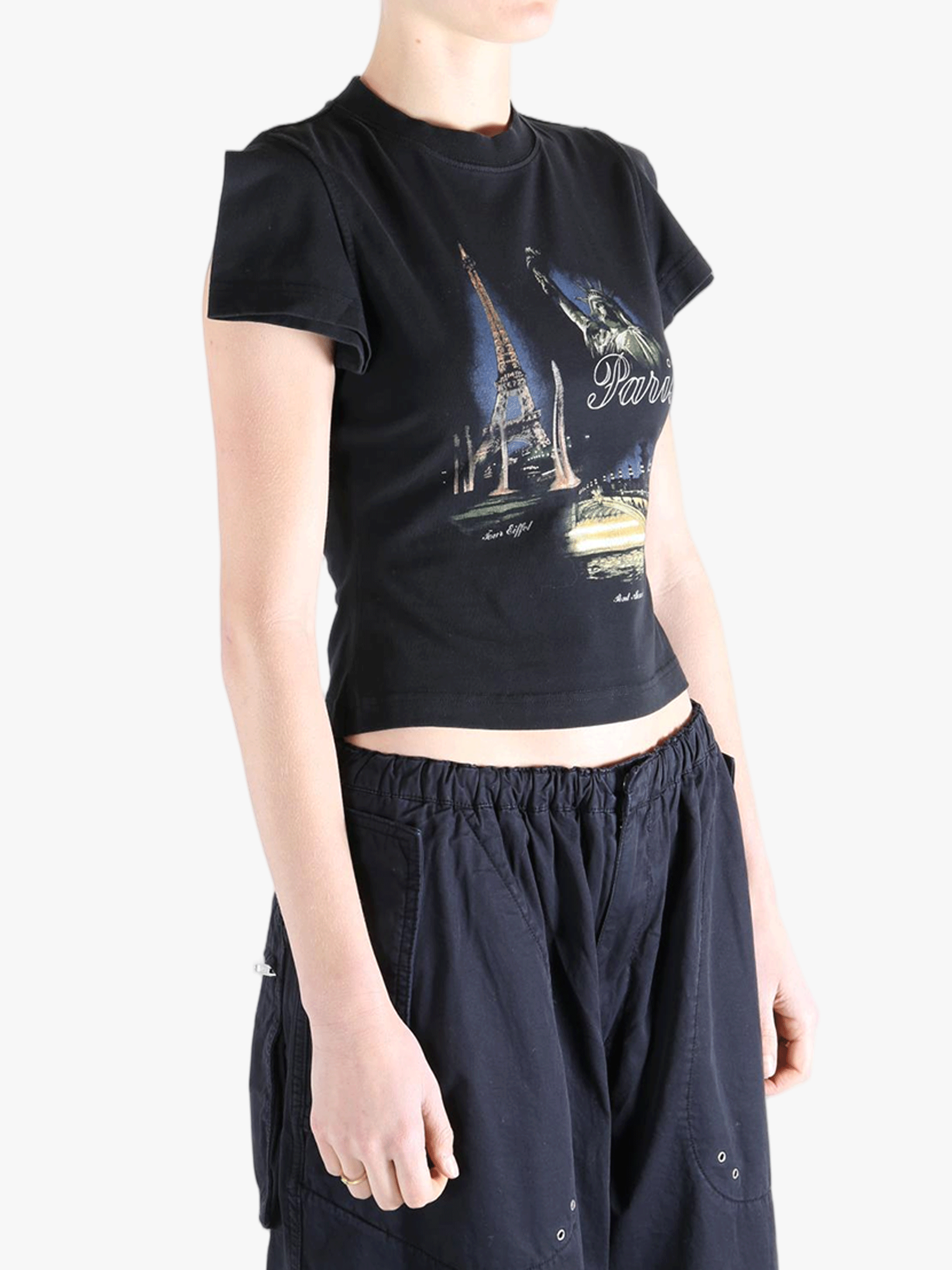 Black t-shirt worn by a person, showing the t-shirt's fit