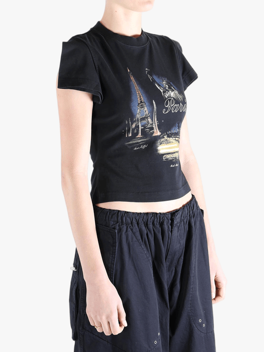 Black t-shirt worn by a person, showing the t-shirt's fit