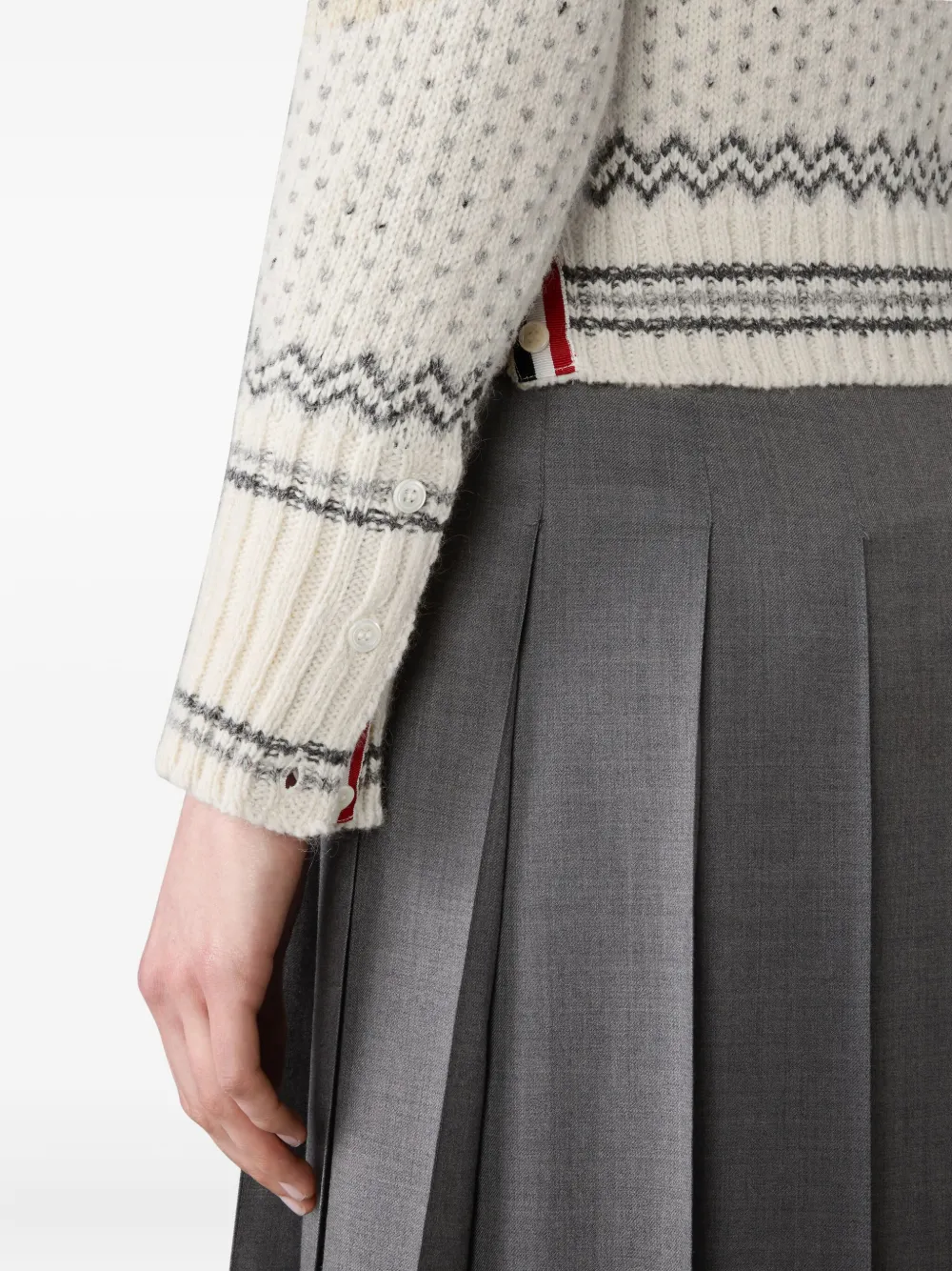 Close up of white knitwear, showing texture of the Wool fabric