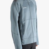 Blue jacket worn by a person, showing the jacket's fit