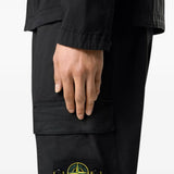 Black pants worn by a person, showing the pants fit