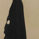 Black jacket worn by a person, showing the jacket fit