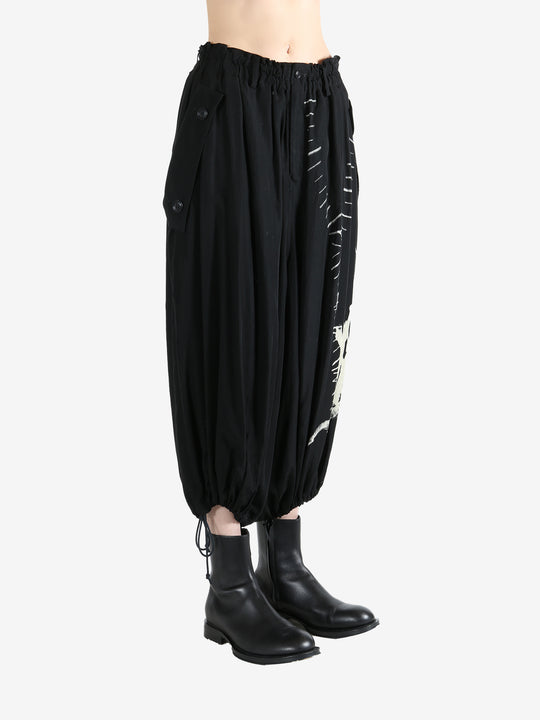 Black pants worn by a person, showing the pants fit