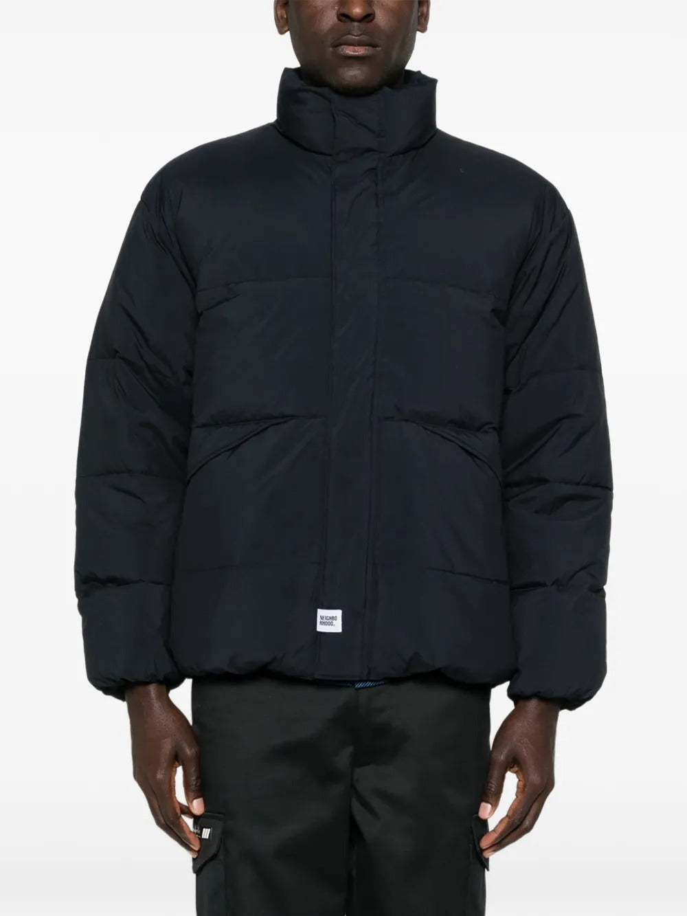 Black jackets worn by a person, showing the jackets fit