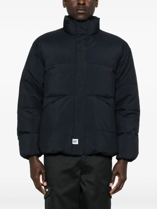 Black jackets worn by a person, showing the jackets fit