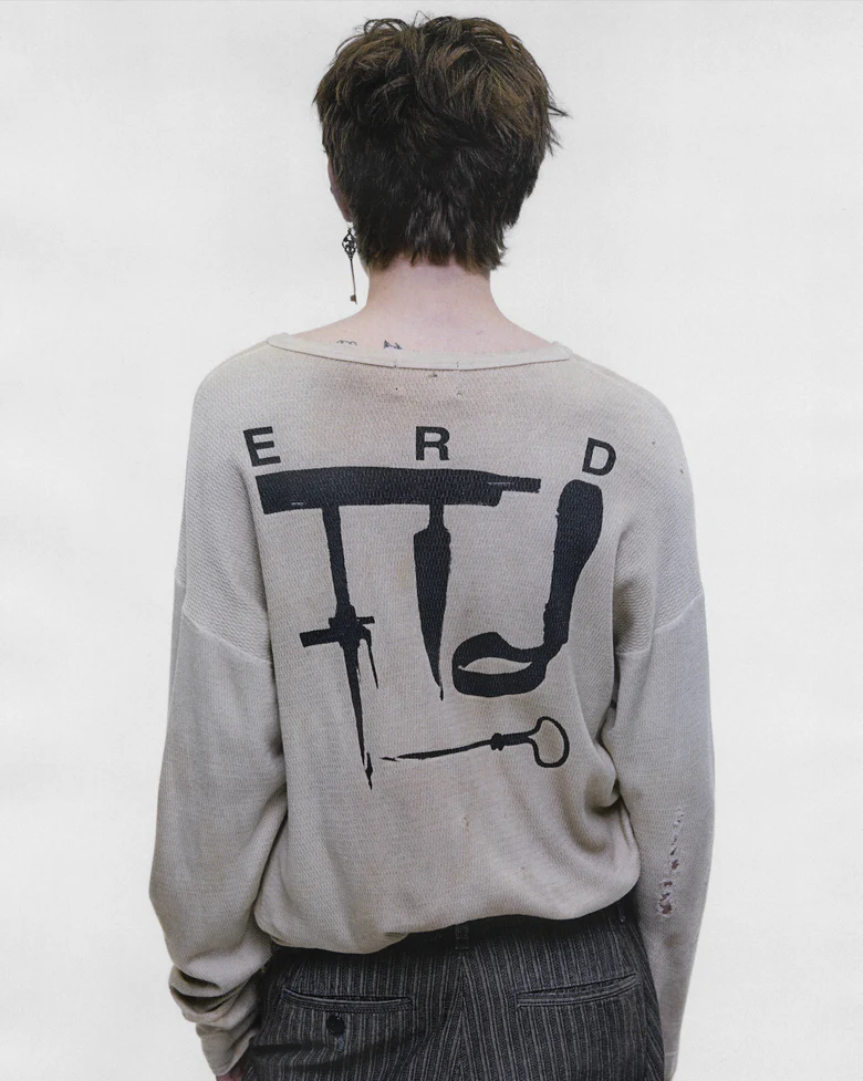 Tan t-shirt worn by a person, showing the t-shirt fit