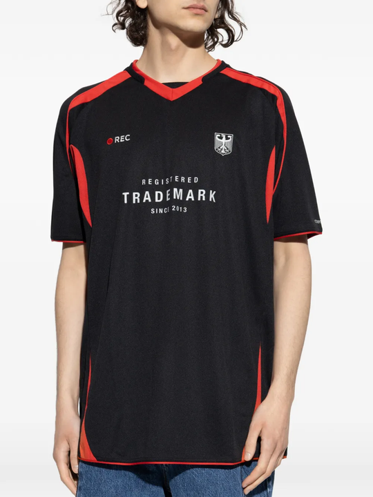 Black t-shirt, worn by a person, showing the t-shirt fit