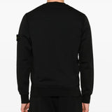 Black sweatshirt worn by a person, showing the sweatshirt fit