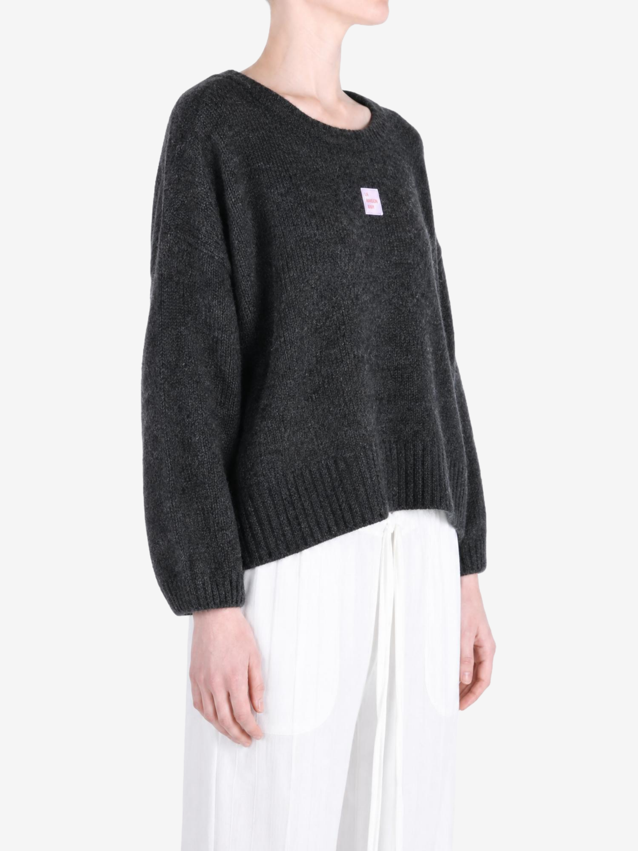 Grey hoodie worn by a person, showing the hoodie fit