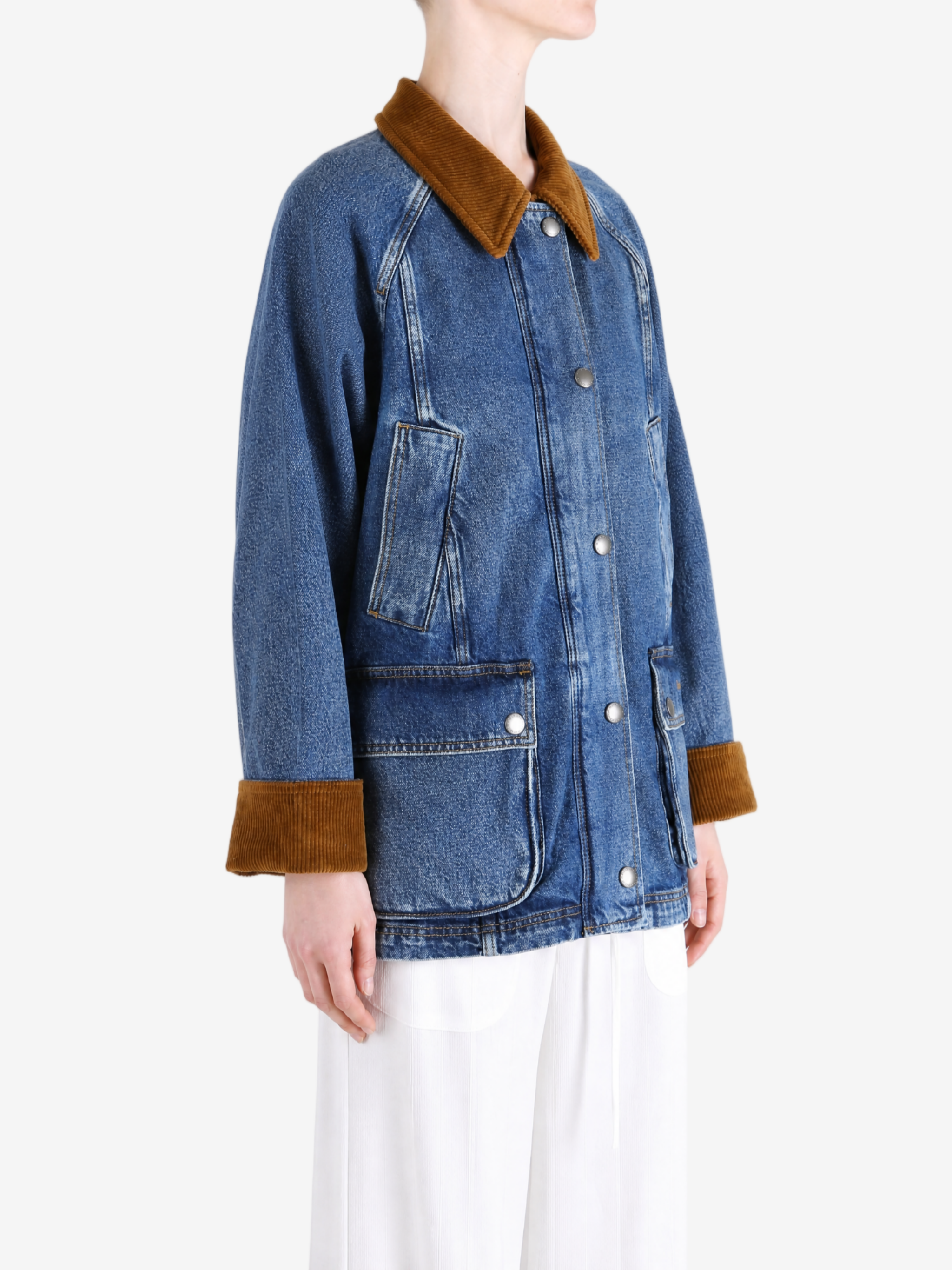 Blue jacket worn by a person, showing the jacket fit