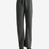 Grey pants worn by a person, showing the pants' fit