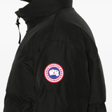 Close up of black jacket,showing texture of the polyester fabric.