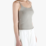 Grey tops worn by a person, showing the tops fit