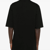 Black t-shirt worn by a person, showing the t-shirt's fit