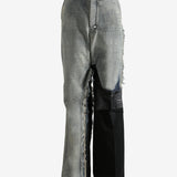 Grey jeans worn by a person, showing the jeans's fit